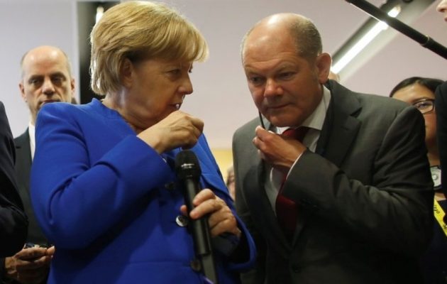 DW: «Αναίμακτη» λύση για την Ελλάδα θέλουν Μέρκελ-Σολτς